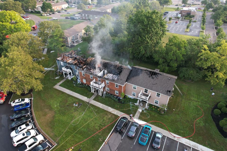 Flames could be seen from the roof of an apartment fire in Washington Township early Thursday morning.