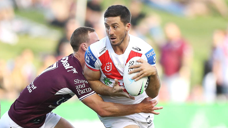 Ben Hunt is seen here running the ball for the Dragons against Manly. 