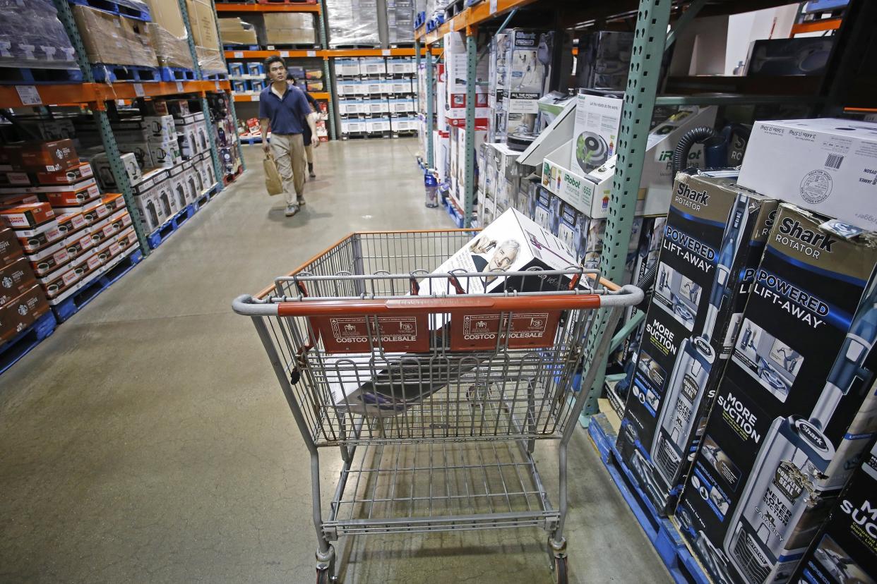 small appliance aisle at Costco and a Dyson vac in cart