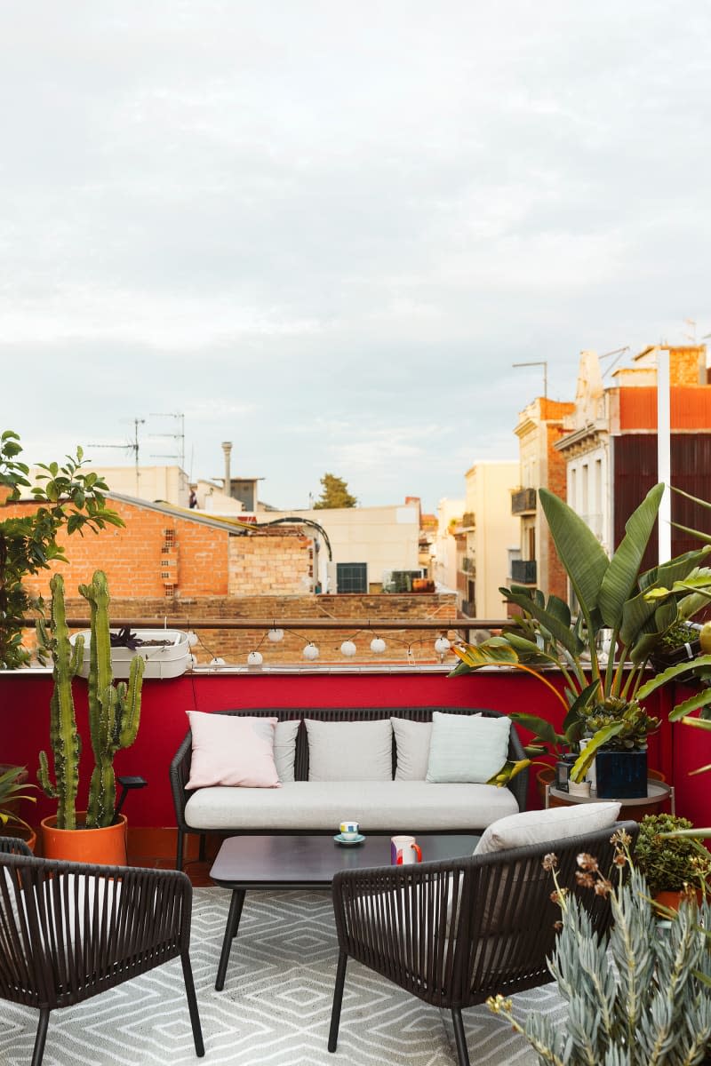 An outdoor space with plants and sitting area.