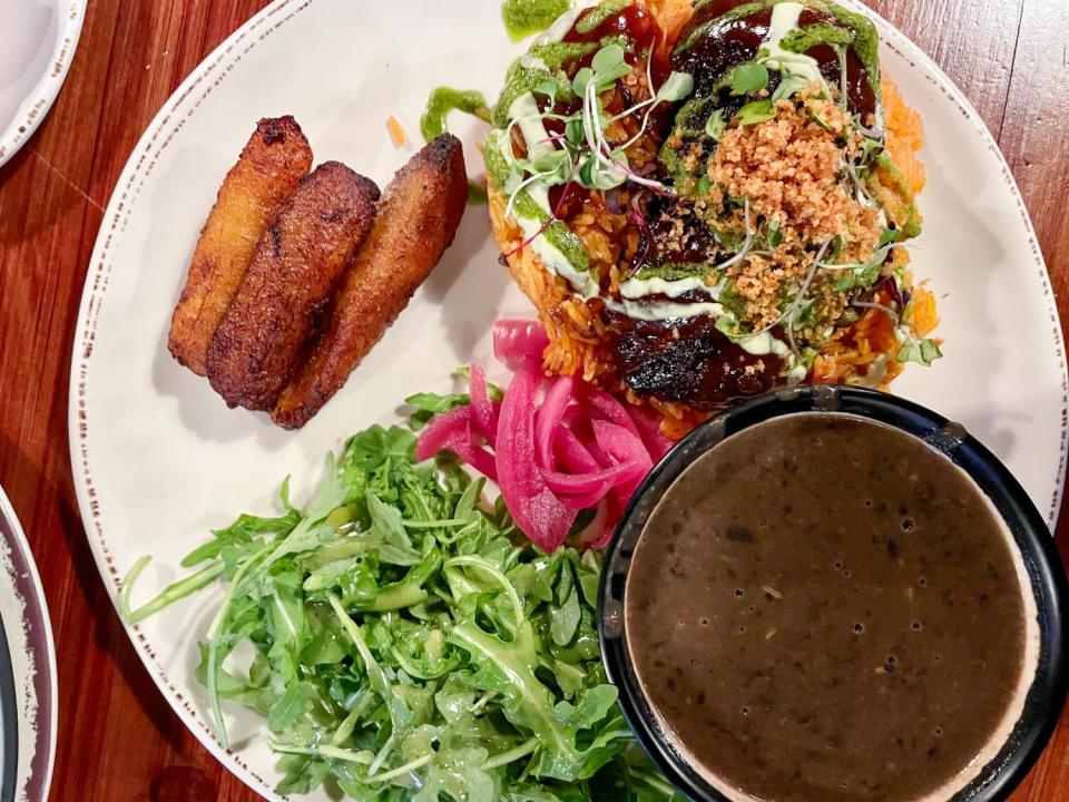 Jollof rice platter with root beer-braised short rib from Two Hommés.