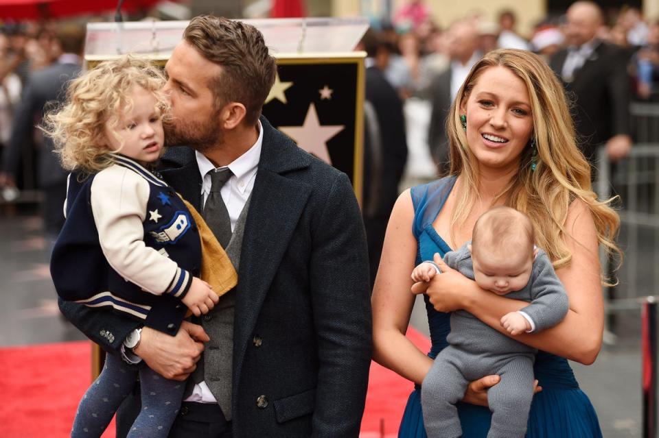 Ryan Reynolds and Blake Lively pose with their daughters during Hollywood Walk of Fame ceremony in December 2016 (Getty Images)