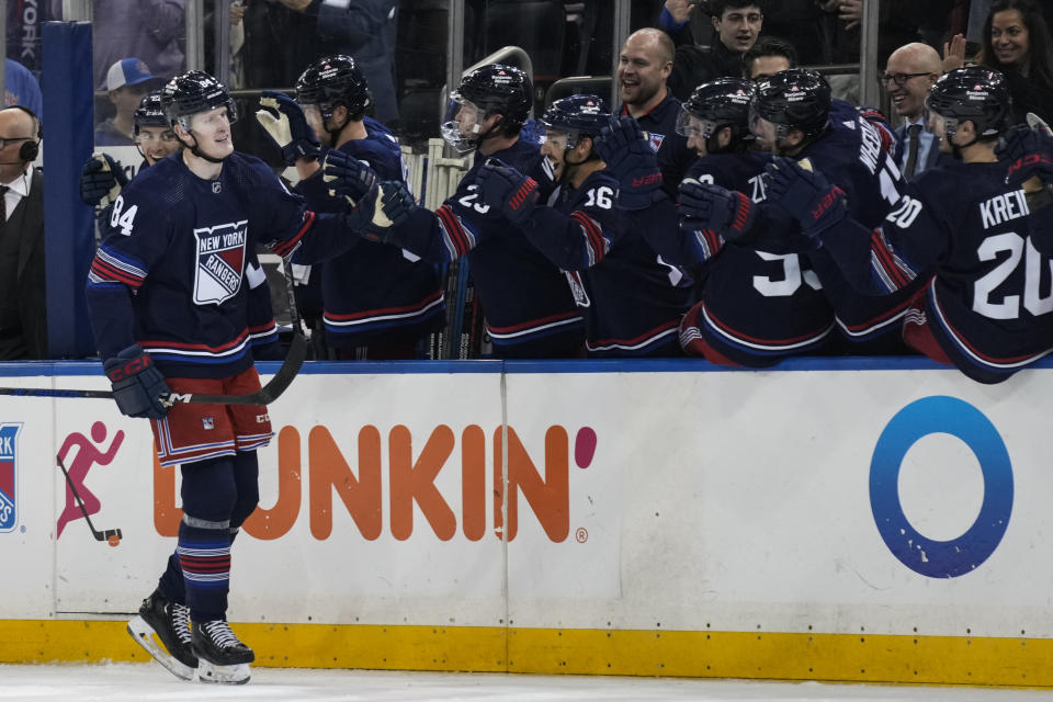 New York Rangers' Adam Edstrom, left, is congratulated for this goal against the Anaheim Ducks during the third period of an NHL hockey game Friday, Dec. 15, 2023, in New York. (AP Photo/Seth Wenig)