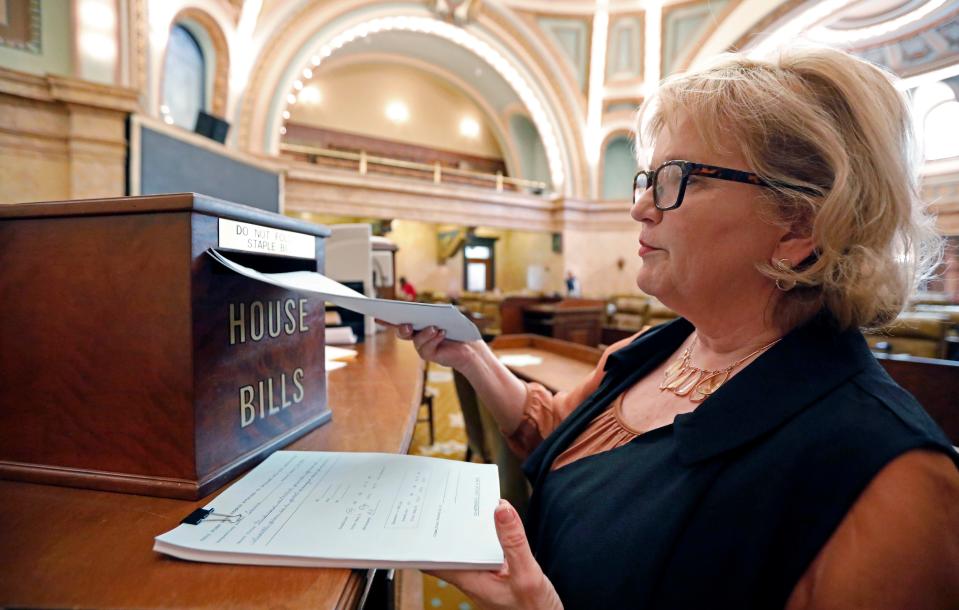 Rep. Becky Currie, R-Brookhaven, files a number of bills in House chambers at the Capitol in Jackson, Miss., Thursday, Jan. 10, 2019. Lawmakers have dropped more than 2,000 bills by the Tuesday deadline.