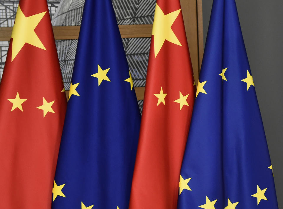 FILE - EU and Chinese flags are seen at the Europa building in Brussels, Tuesday, Dec. 17, 2019. The European Union will seek China's assurances that it won't assist Russia in circumventing economic sanctions leveled over the invasion of Ukraine at an annual summit Friday, April 1, 2022. (John Thys/Pool Photo via AP, File)