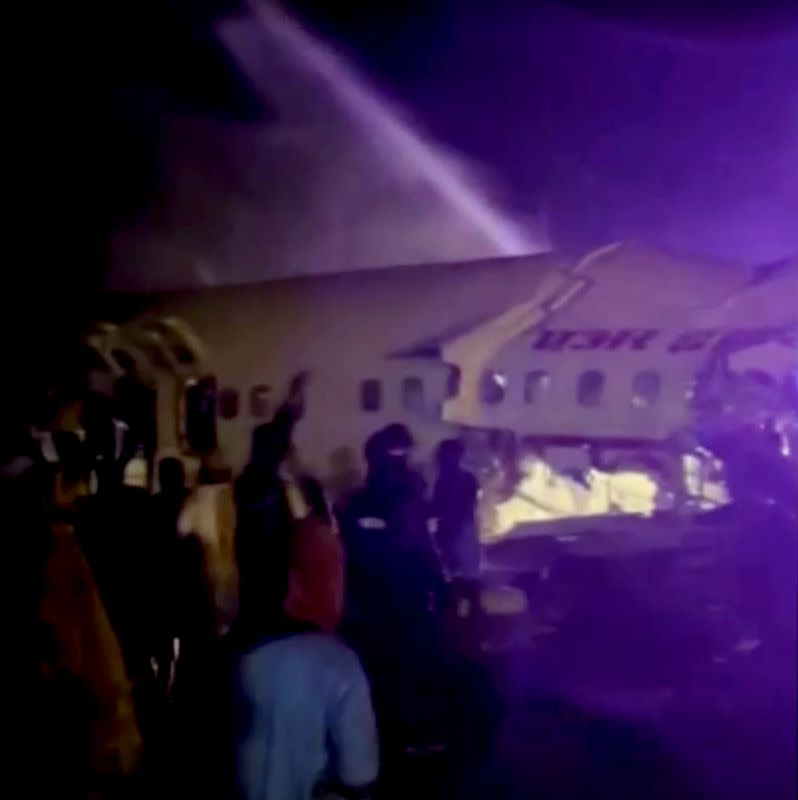 A passenger plane that crashed after it overshot the runway is seen at Calicut International Airport in Karipur