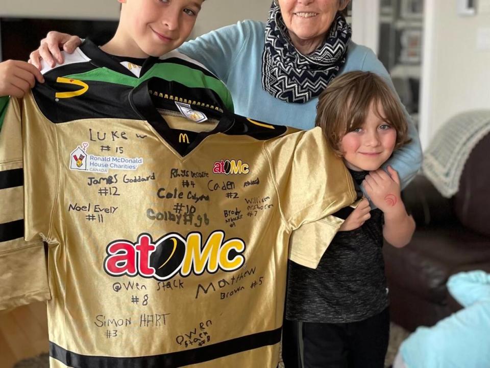 Simon Hart, left, with his grandmother, Mary Oldford, and his brother, Levi. The two boys were the only ones around on July 18 when Oldford began choking. She credits them with saving her life. (Submitted by Amy Oldford - image credit)