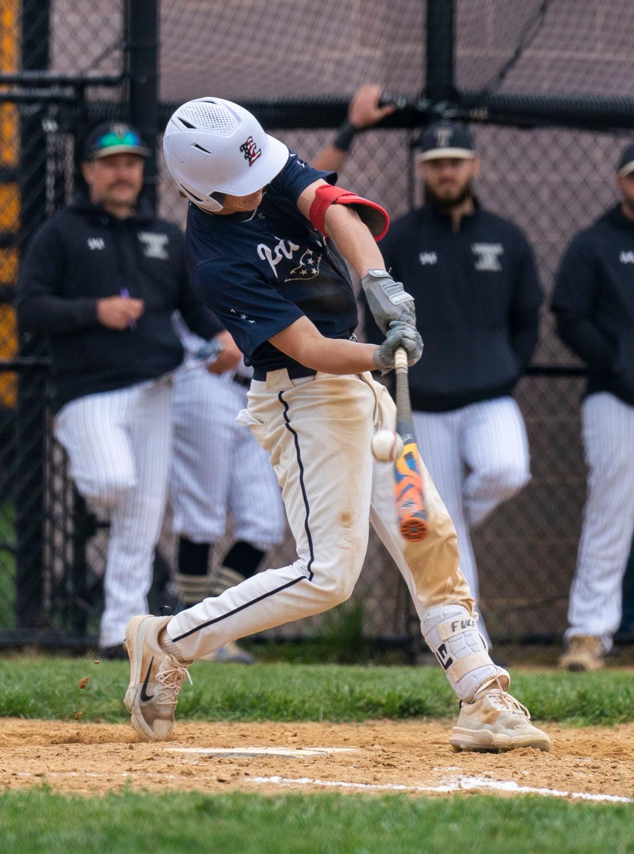 Central Bucks East's Chase Fulford (6) hits the ball against Harry S. Truman.