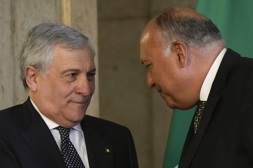 Egyptian Foreign Minister Sameh Shoukry, right, listens to his Italian counterpart Antonio Tajani after a press conference at the foreign ministry headquarters in Cairo, Egypt, Sunday, Jan. 22, 2023. (AP Photo/Amr Nabil)