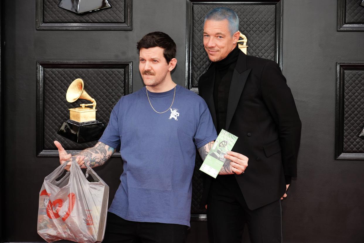 Dillon Francis and Diplo pose together on the 2022 Grammys red carpet.