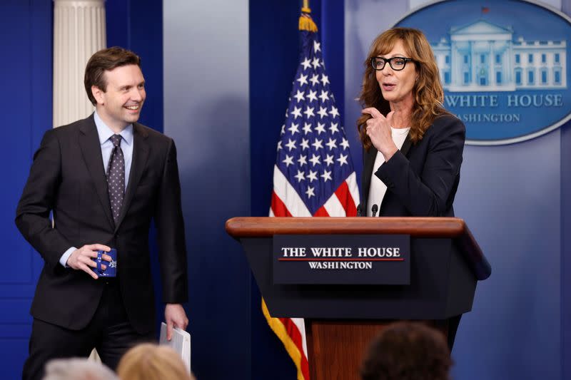 FILE PHOTO: Earnest and actress Janney stand together at the lectern before the daily press briefing at the White House in Washington