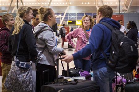 Travelers wait to check in for their flight at John F. Kennedy International Airport in New York, November 27, 2013. REUTERS/Lucas Jackson