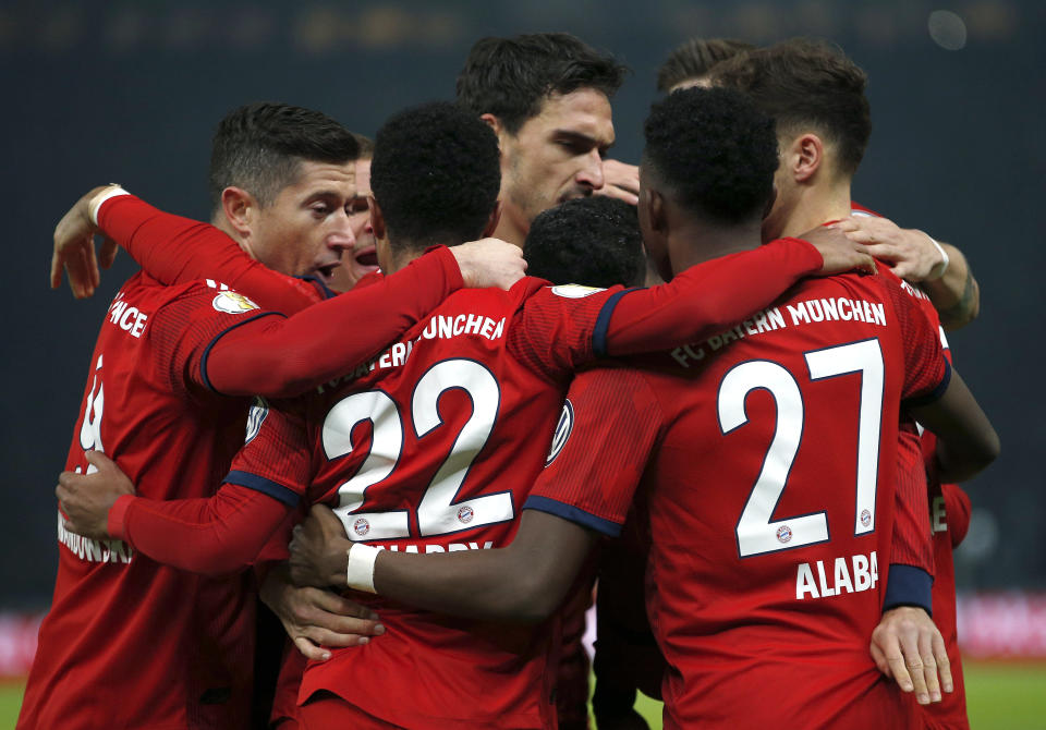 Bayern's scorer Serge Gnabry and his teammates celebrate their side's first goal during a German Soccer Cup round of sixteen match between Hertha BSC Berlin and FC Bayern Munich in Berlin, Germany, Wednesday, Feb. 6, 2019. (AP Photo/Michael Sohn)