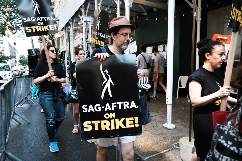 Members of the actors SAG-AFTRA union walk a picket line with screenwriters outside of Netflix's New York office on the first day of the actors' strike on July 14, 2023 in New York City. Members of SAG-AFTRA, Hollywoodâ€™s largest union which represents actors and other media professionals, joined striking WGA (Writers Guild of America) workers in the first joint walkout against the studios since 1960. The strike could shut down film productions completely with writers in the third month of their strike against the Hollywood studios. (Spencer Platt / Getty Images)