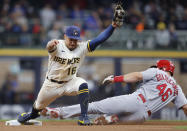 Milwaukee Brewers second baseman Kolten Wong (16) forces out St. Louis Cardinals' Paul Goldschmidt (46) at second base during the sixth inning of a baseball game Thursday, Sept. 23, 2021, in Milwaukee. (AP Photo/Jeffrey Phelps)