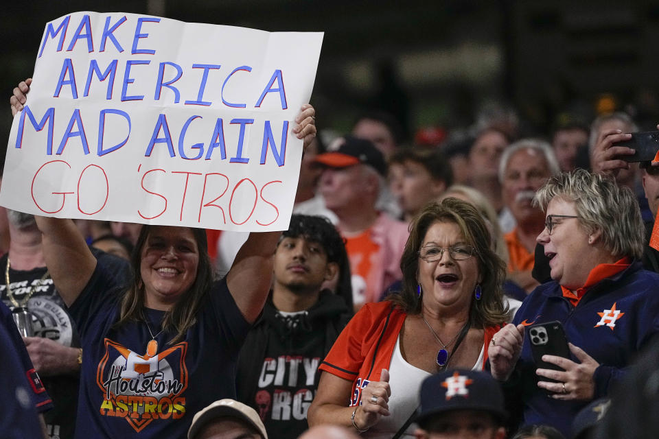 Fans watch play during the fifth inning in Game 1 of baseball's American League Championship Series between the Houston Astros and the New York Yankees, Wednesday, Oct. 19, 2022, in Houston. (AP Photo/Kevin M. Cox)