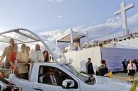 Pope Francis, accompanied by youths, arrives with his popemobile to attend a prayer vigil on the occasion of the World Youth Days, in Campus Misericordiae in Brzegi, near Krakow, Poland, Saturday, July 30, 2016. (AP Photo/Gregorio Borgia)
