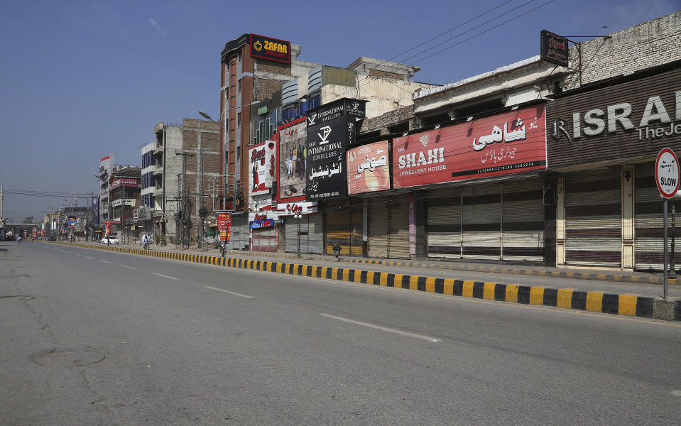 A market is deserted due to the closure after the government announced new restrictions for the COVID-19 measures, in Peshawar, Pakistan, Saturday, May 8, 2021. Pakistani authorities started implementing a plan of nine-days lockdown from May 8 to 16 till end of the Eid al-Fitr holidays. New restrictions also include closure of all tourist resorts, beaches, hotels, restaurants, shopping centers, parks and other public places to try to control the spread of the coronavirus. (AP Photo/Muhammad Sajjad)