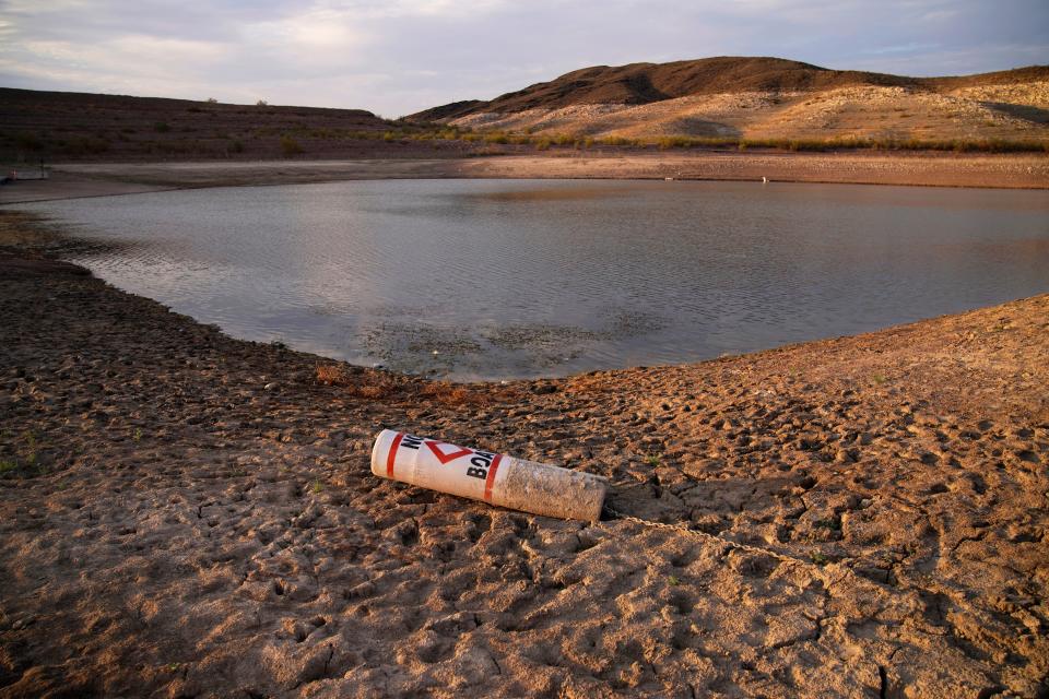 A buoy rests on the ground at a closed boat ramp on Lake Mead at the Lake Mead National Recreation Area near Boulder City, Nev., on Aug. 13, 2021.