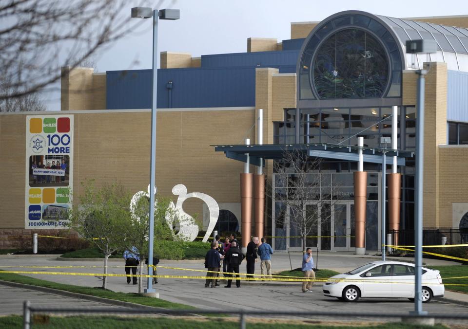 Police officers gather at the scene of a shooting at the Jewish Community Center of Greater Kansas City in Overland Park, Kansas April 13, 2014. (REUTERS/Dave Kaup)