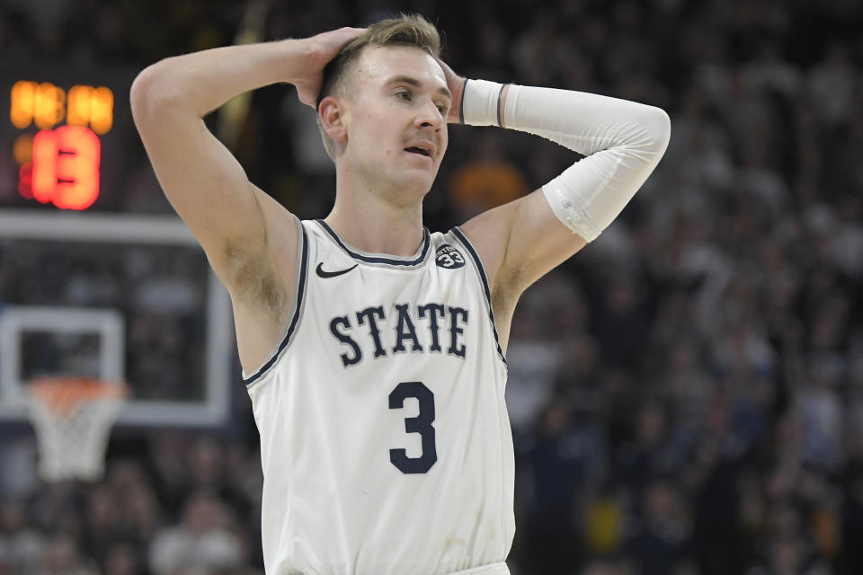 Utah State guard Steven Ashworth reacts after forward Dan Akin was called for a foul against San Diego State during the second half of an NCAA college basketball game Wednesday, Feb. 8, 2023, in Logan, Utah. (AP Photo/Eli Lucero)