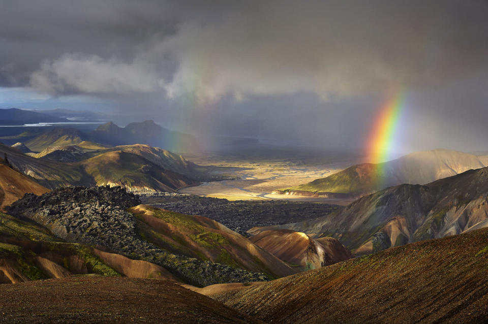 A landscape view of a rainbow appearing on Iceland’s Laugavegur trek. (Michael Fersch/Caters News Agency)