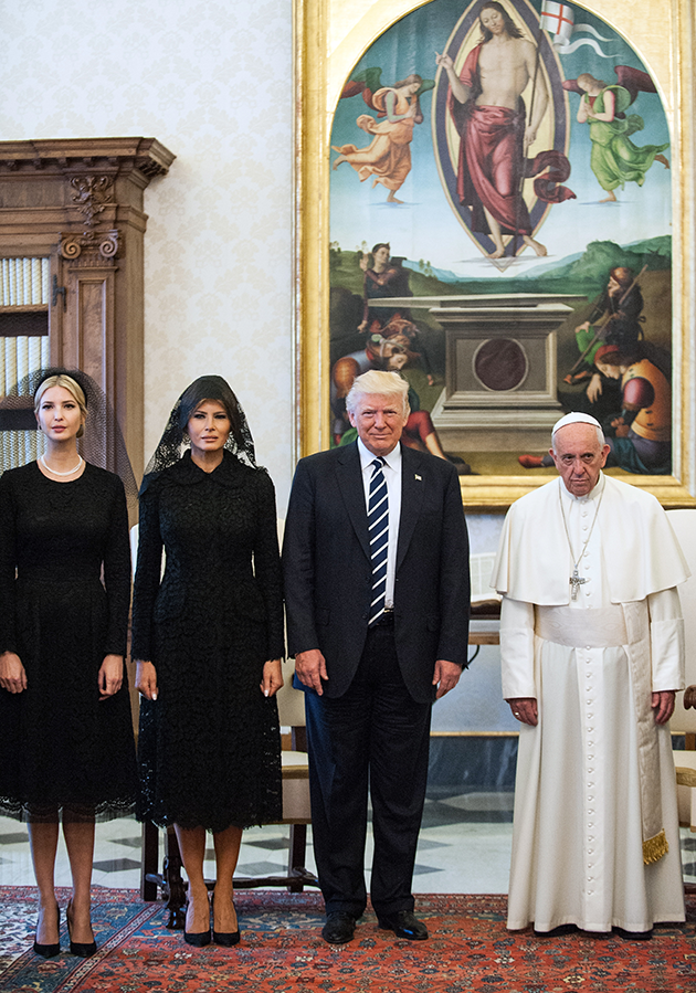 They both kept with tradition and wore black head scarfs. Photo: Getty