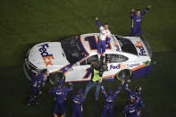 Denny Hamlin (11) celebrates in front of the grandstands after winning the NASCAR Daytona 500 auto race at Daytona International Speedway, Monday, Feb. 17, 2020, in Daytona Beach, Fla. (AP Photo/Phelan M. Ebenhack)