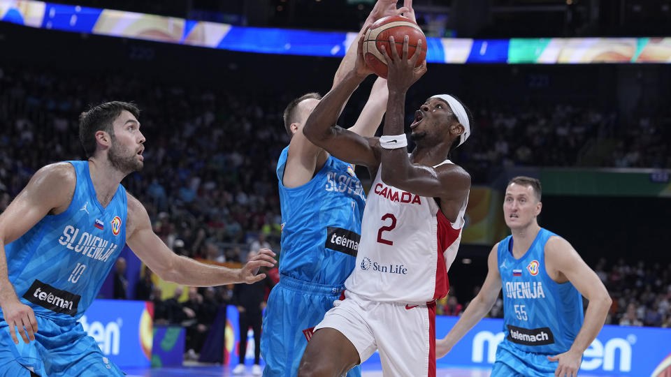 Shai Gilgeous-Alexander (2) and Canada are off to the semis at the FIBA World Cup. (AP Photo/Michael Conroy)