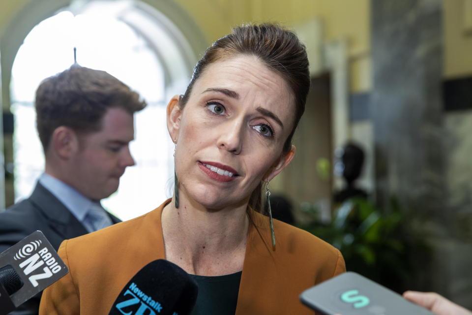 New Zealand Prime Minister Jacinda Ardern speaks during a media stand-up on her way to Question Time at Parliament, in Wellington, New Zealand Tuesday, Dec. 1, 2020. New Zealand has joined Australia in denouncing a graphic tweet posted by a Chinese official that shows a fake image of a grinning Australian soldier holding a bloodied knife to a child’s throat. (Mark Mitchell/NZ Herald via AP)