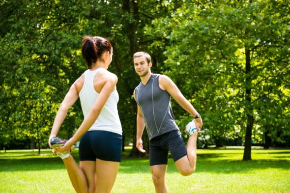 young couple exercising and...