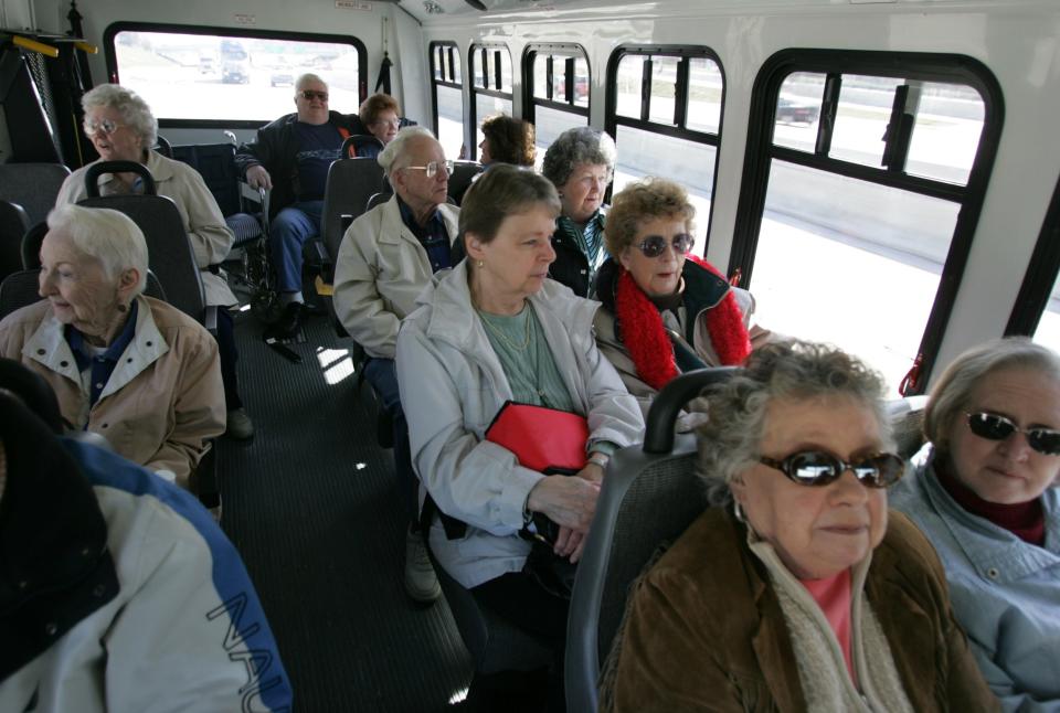 This photo from the mid-2000s shows a group of Westland seniors on a bus to Canada to buy cheaper prescription drugs.