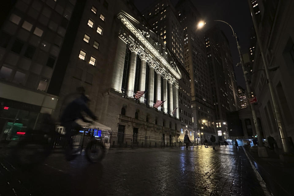 A bike approaches the New York Stock Exchange on Tuesday, Nov. 21, 2023 in New York. World shares were mixed on Wednesday in cautious trading after Wall Street's rally ran out of momentum. (AP Photo/Peter Morgan)