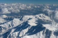 Snow-capped Himalayan mountains in the disputed Kashmir region are pictured during a commercial flight from Srinagar to Jammu on January 9, 2013. India delivered a dressing-down Wednesday to Islamabad's envoy to Delhi as it accused Pakistan's army of beheading one of two soldiers killed in Kashmir, but both sides warned against inflaming tensions