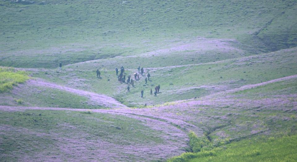 The group of kidnapped people escape across the frontline from ISIS-controlled territory near Sinjar Mountain, Iraq.