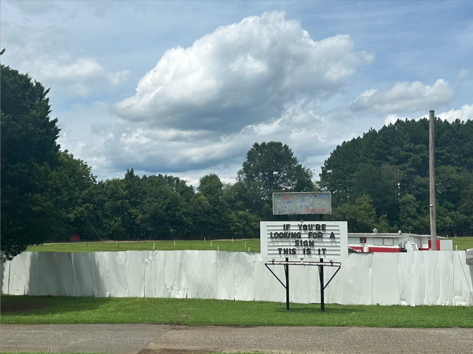 The Belmont Drive-In’s marquee reads, “if you’re looking for a sign, this is it,” as it plans to reopen soon.