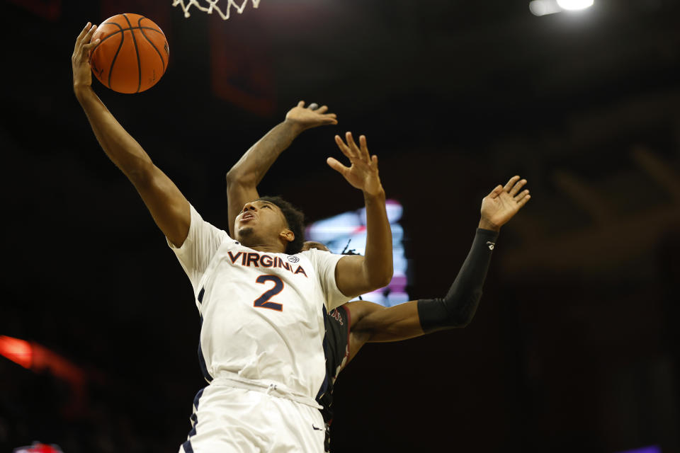 Dec 5, 2023; Charlottesville, Virginia, USA; Virginia Cavaliers guard Reece Beekman (2) shoots the ball as North Carolina Central Eagles guard Keishon Porter (11) defends in the second half at John Paul Jones Arena. Mandatory Credit: Geoff Burke-USA TODAY Sports