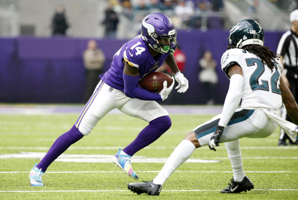 Minnesota Vikings wide receiver Stefon Diggs, left, runs from Philadelphia Eagles cornerback Sidney Jones, right, after catching a pass during the first half of an NFL football game, Sunday, Oct. 13, 2019, in Minneapolis. (AP Photo/Bruce Kluckhohn)