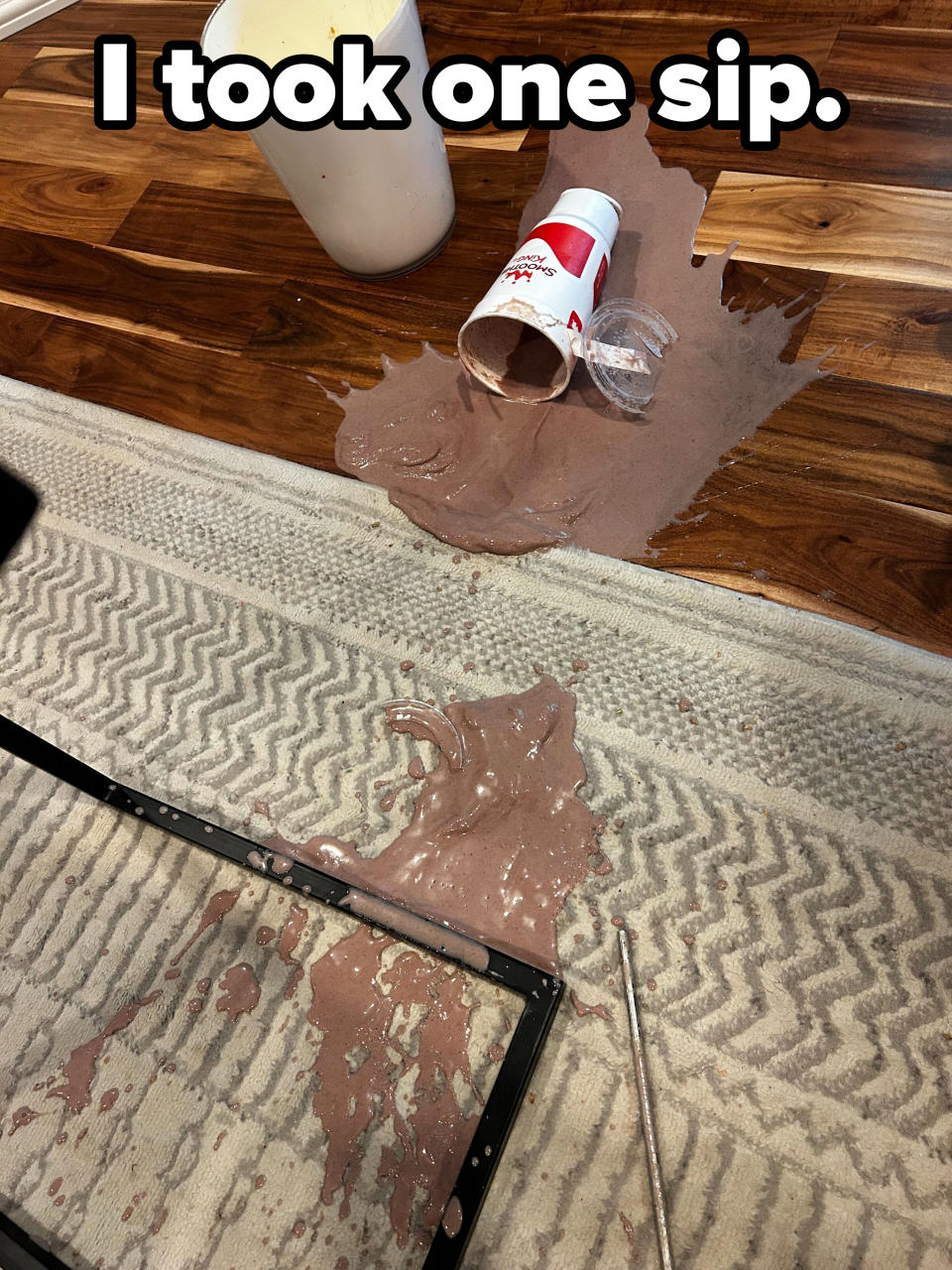 A large chocolate smoothie falls all over a rug with the caption "I took one sip"