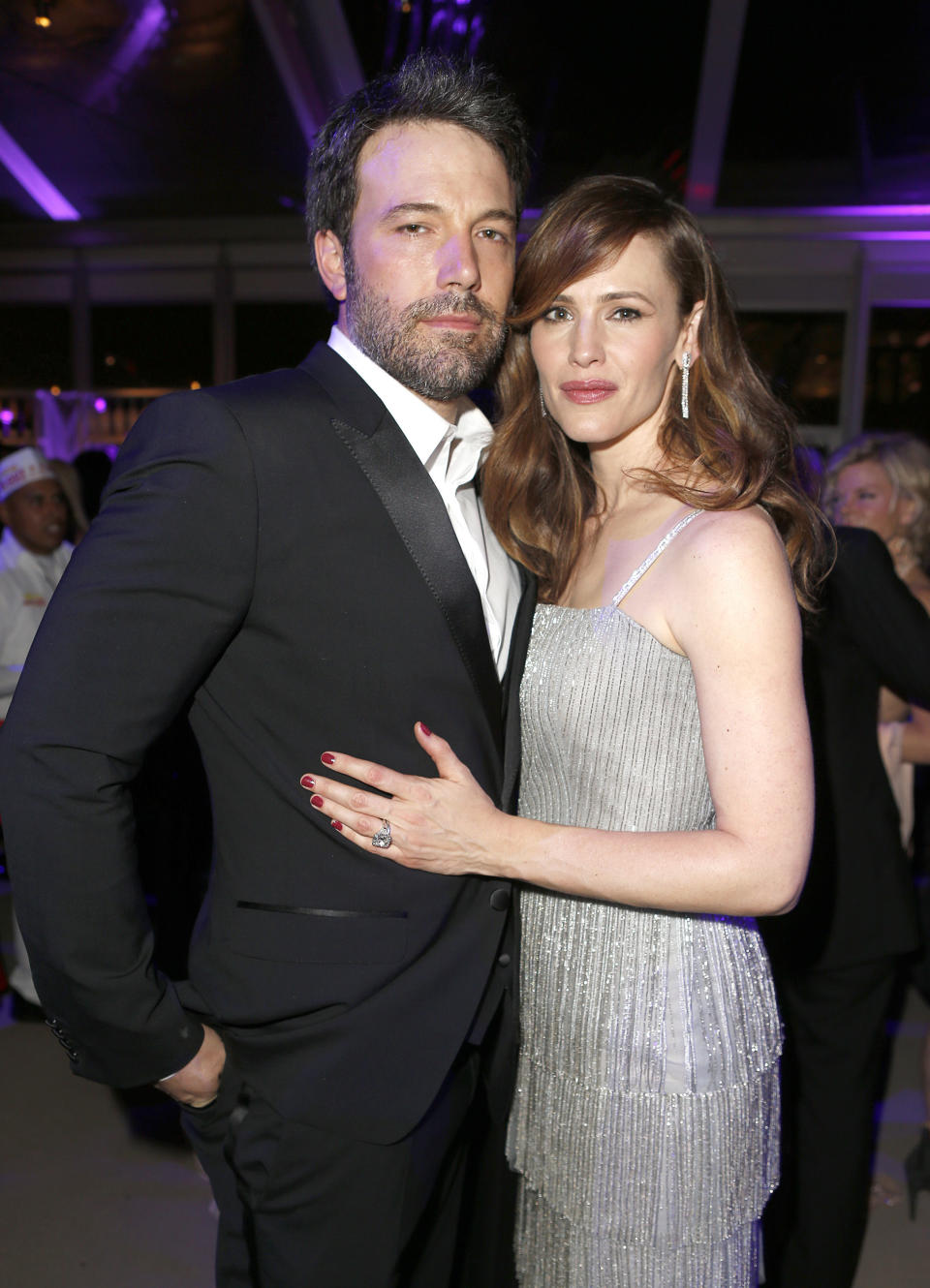 Affleck poses for a picture with Garner's hand on his waist