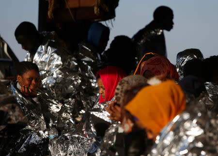 Migrants rest on the Malta-based NGO Migrant Offshore Aid Station (MOAS) ship Phoenix after being rescued from a rubber dinghy in the central Mediterranean in international waters off the coast of Sabratha in Libya, April 15, 2017. REUTERS/Darrin Zammit Lupi