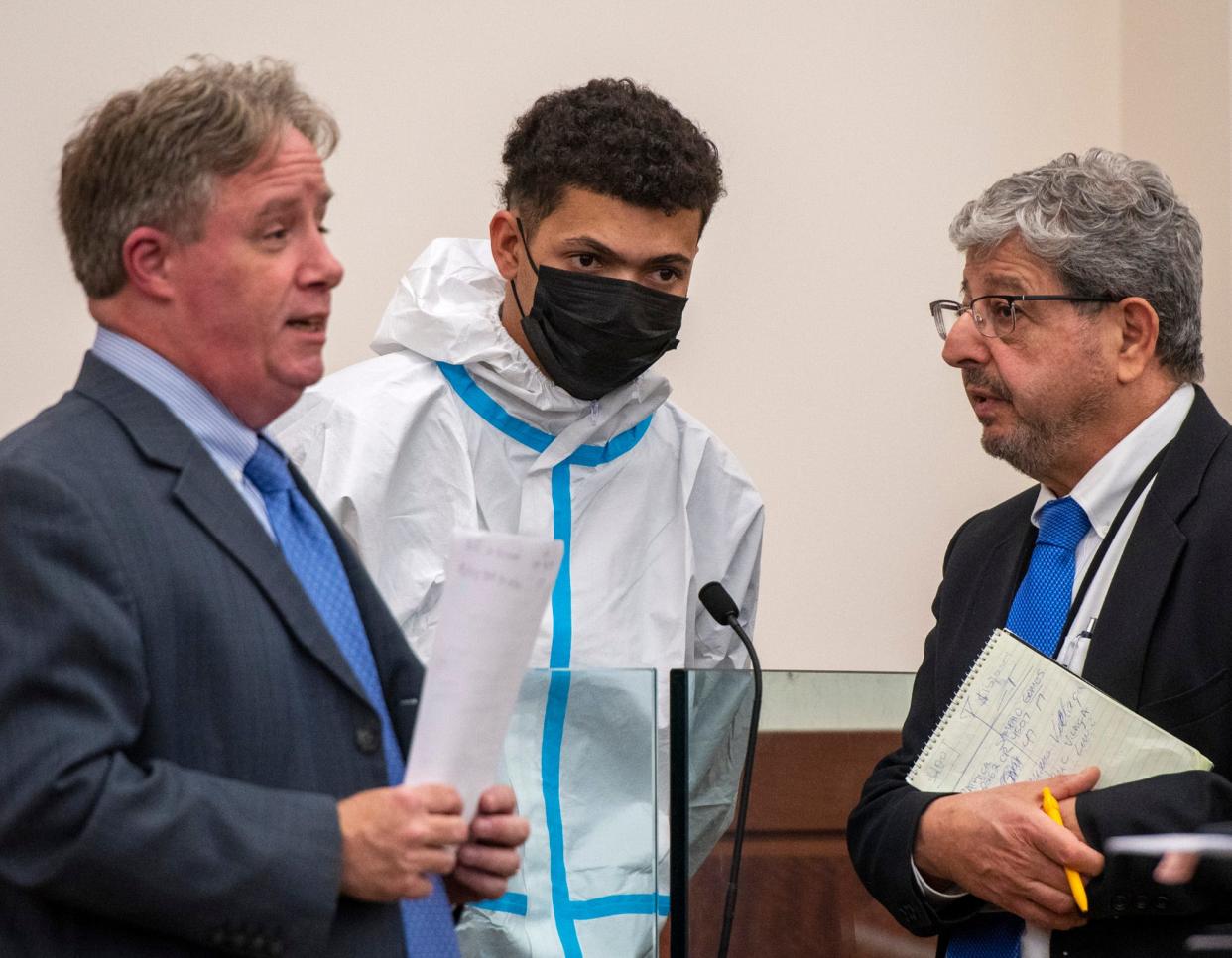 Patriky Sampaio Gomes, 21, of Worcester, is arraigned Thursday in Central District Court. He is flanked by lawyer Sean McGinty, left, and a Portuguese interpreter.