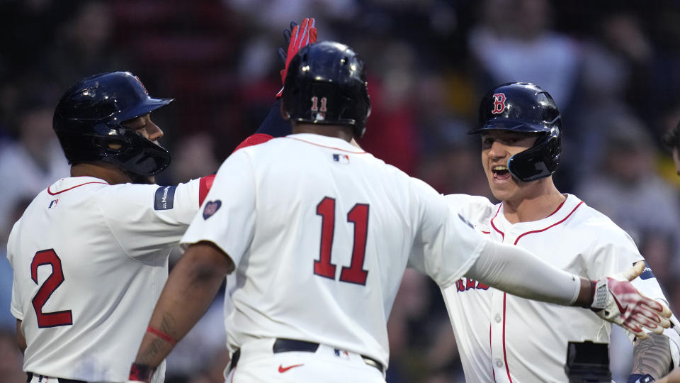 Boston Red Sox's Tyler O'Neill, right, is congratulated after his three-run home run during the first inning of a baseball game, Monday, May 13, 2024, in Boston.(AP Photo/Charles Krupa)