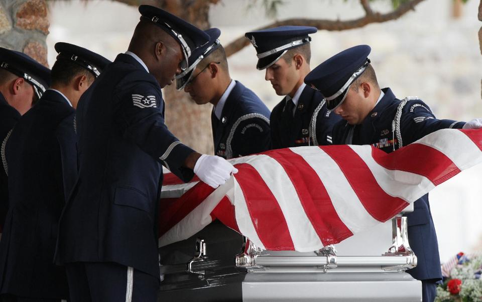 CORRECTS DATE - Air Force servicemen remove the flag draped on the casket of actor Sherman Hemsley who was buried at the Fort Bliss National Cemetery with military honors, Wednesday, Nov. 21, 2012 in Fort Bliss, Texas. Friends and family remembered Hemsley at his funeral service in Texas by showing video clips of his best known role as George Jefferson on the TV sitcom "The Jeffersons." He died in July but a fight over his estate has delayed his burial. (AP Photo/The El Paso Times, Mark Lambie) EL DIARIO OUT; JUAREZ MEXICO OUT AND EL DIARIO DE EL PASO OUT