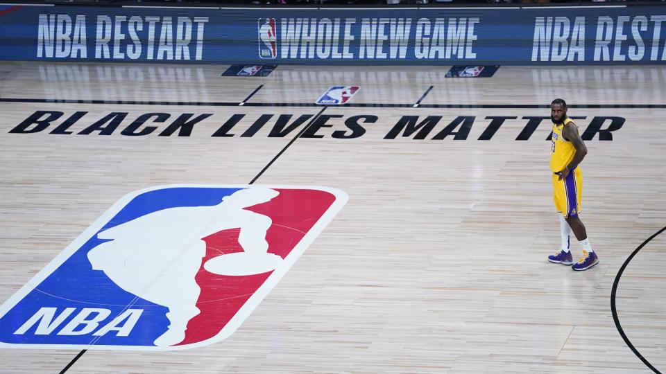 Los Angeles Lakers' LeBron James prepares to face the Denver Nuggets during the first half of an NBA basketball game Monday, Aug. 10, 2020, in Lake Buena Vista, Fla. (AP Photo/Ashley Landis, Pool)