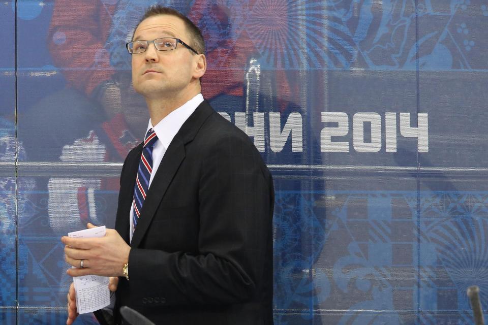 Team USA head coach Dan Bylsma looks up at the scoreboard during the second period of men's quarterfinal hockey game against the Czech Republic at Shayba Arena at the 2014 Winter Olympics, Wednesday, Feb. 19, 2014, in Sochi, Russia. (AP Photo/J. David Ake)