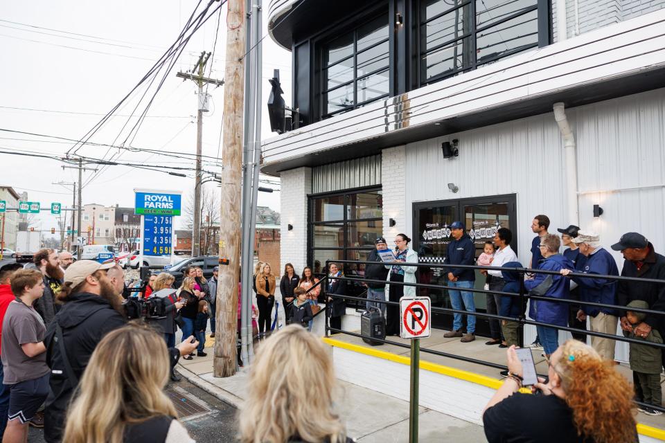 Justine Trucksess, executive director of Main Street Hanover, speaks during the grand opening of Greer's Burger Garage, Thursday, March 28, 2024, in downtown Hanover.