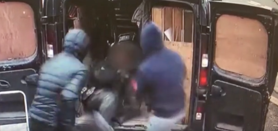 Two men are caught on CCTV pushing their victim into a van in England. Source: Humberside Police