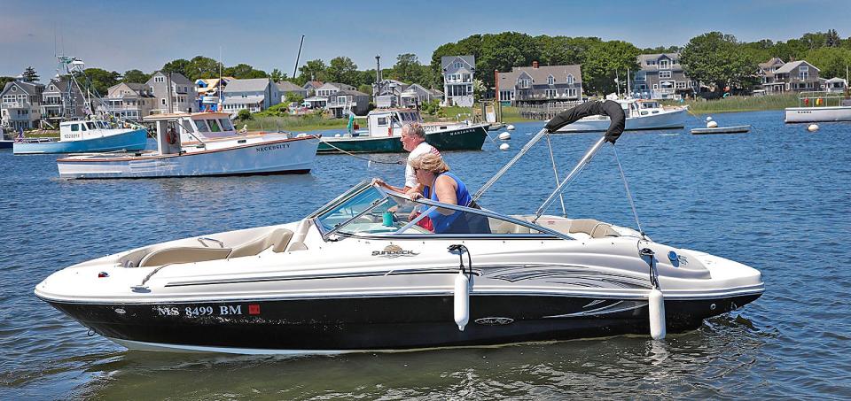 Boat owners Doug and Judy Haartz, of Sudbury, launch their boat in Green Harbor, Marshfield, on Tuesday, June 14, 2022.