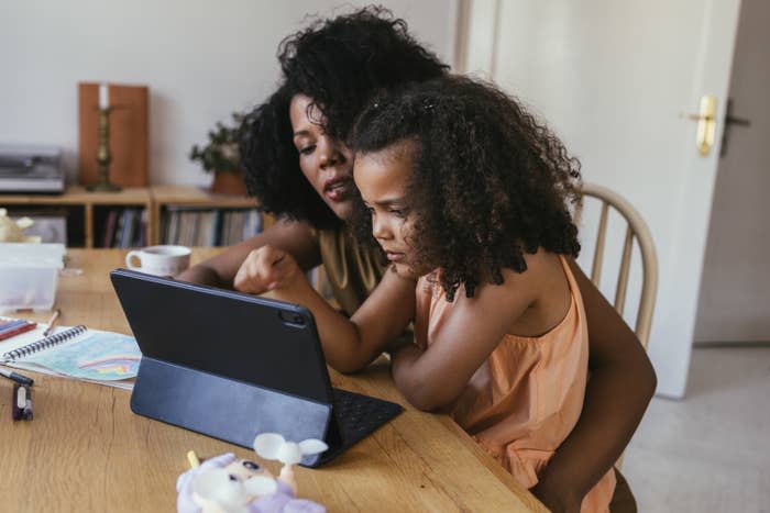 A mom and daughter on an iPad